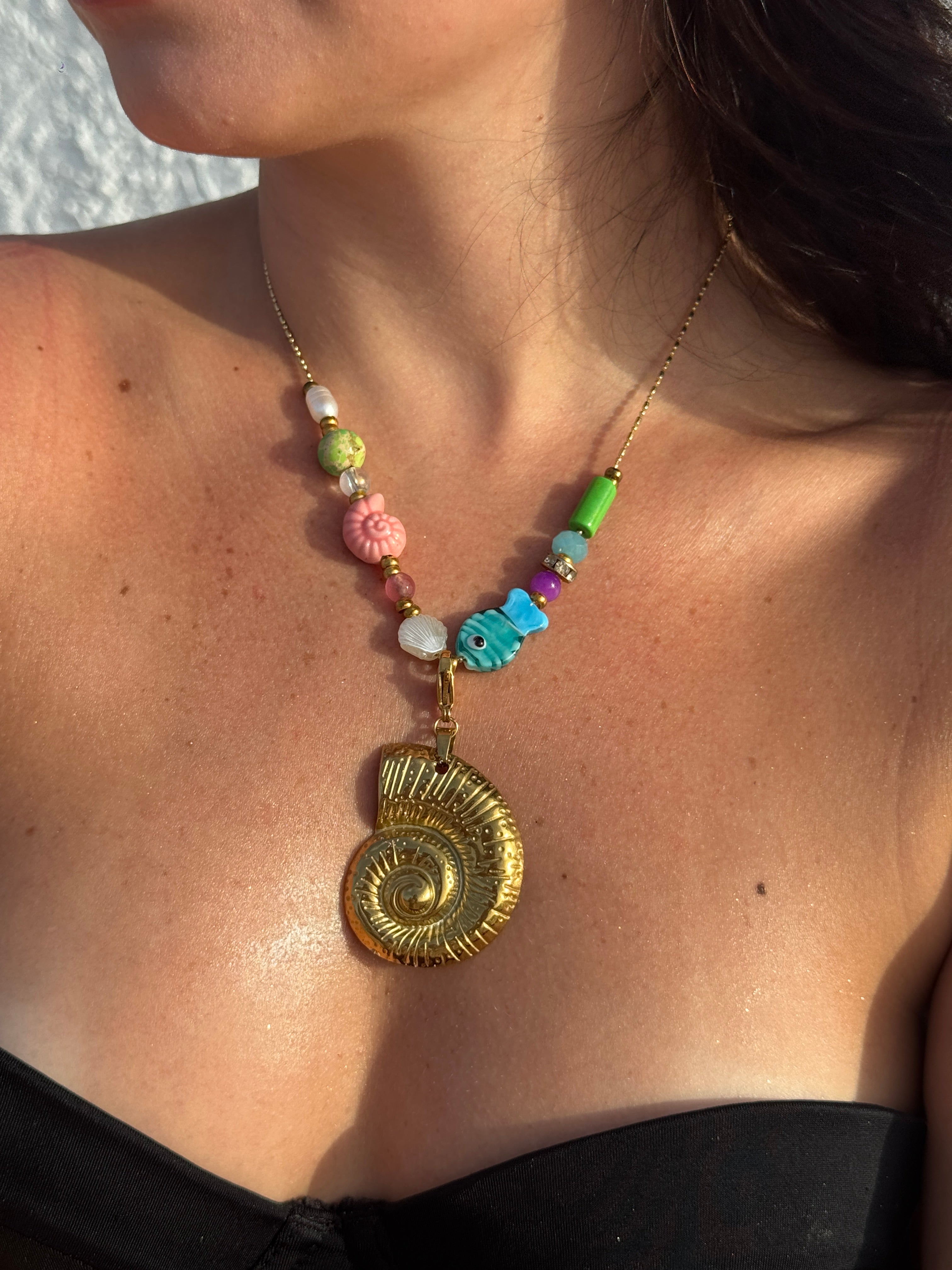 Golden shell charm