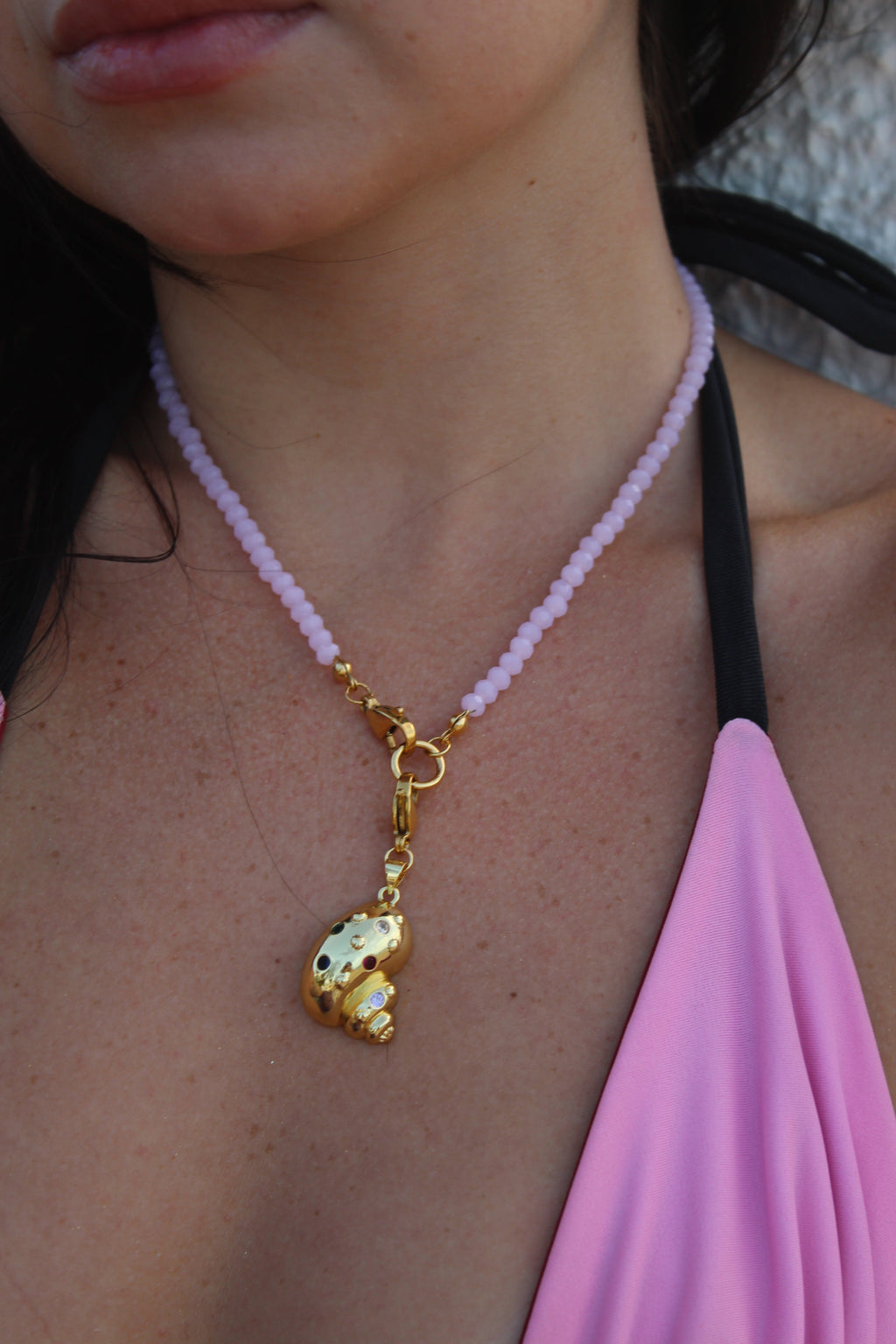 Shiny gold shell charm